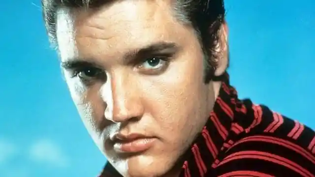 Who was Elvis Presley's manager for more than two decades?