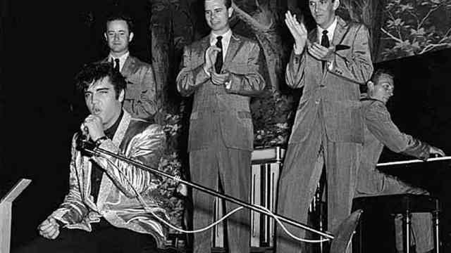 How many music halls of fame has Elvis been inducted into?