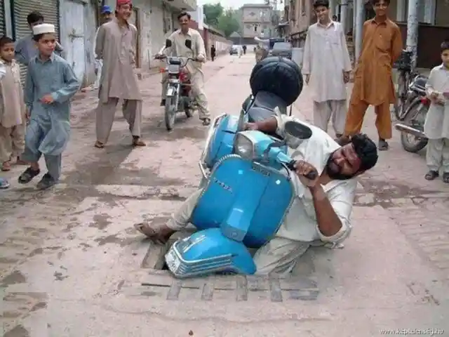 Indian man crashes Vespa