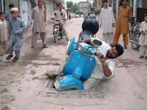 Indian man crashes Vespa